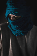 Portraits of a young Berber in the Merzouga desert in Morocco