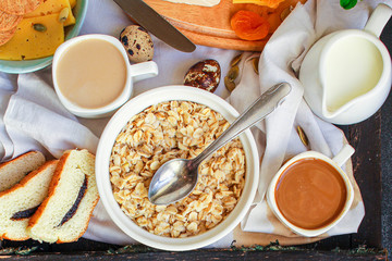 breakfast (oatmeal porridge, dairy products and more, snack) menu concept background. top view. copy space for text