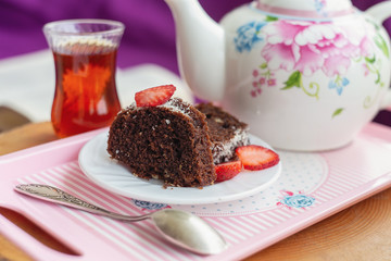 Teatime on a balcony with homemade cake