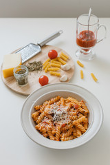 italian homemade pasta with tomato sauce and parmesan