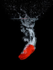 Pepper falling into the water