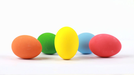 Colorful easter eggs isolated on a white, focus on yellow egg