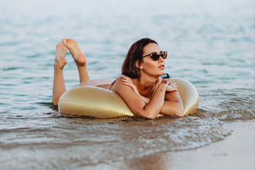 Girl floating in the ocean