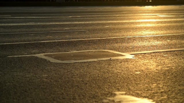 Cars drive along the roadway