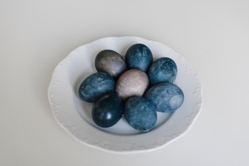Easter blue eggs with cotton on the table