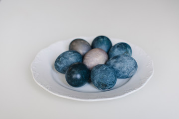 Easter blue eggs with cotton on the table
