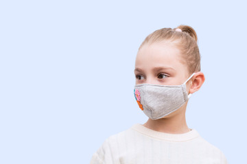 Girl with handmade mask to protect her from Corona virus. Corona virus pandemic.