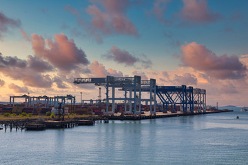 Fototapeta premium Freight cranes and shipping containers on the coast near Boston