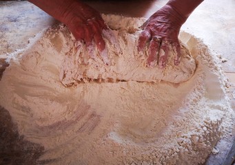 knead the flour with your hands, the classic fountain dough to make bread