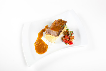 Dishes in white plates on a white background with the application of food design.