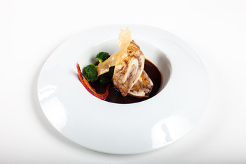 Dishes in white plates on a white background with the application of food design.