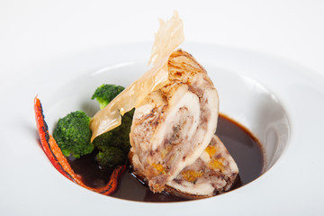 Dishes in white plates on a white background with the application of food design.