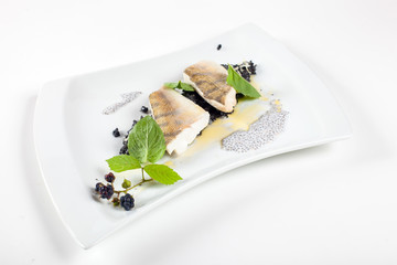 Dishes in white plates on a white background with the application of food design.