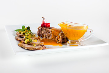 Dishes in white plates on a white background with the application of food design.