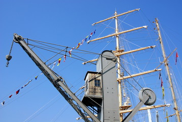 sailing ship mast and loading crane