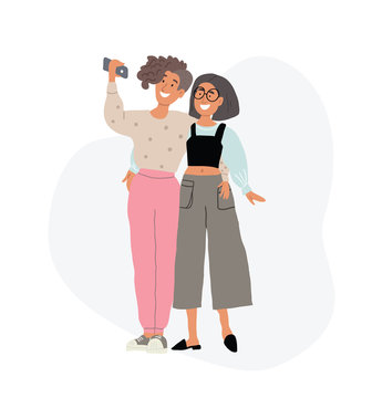 two lesbian girls hugging, taking selfie together