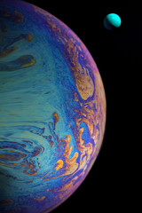 planet in space from a soap bubble