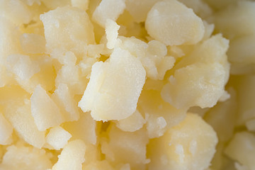 Pieces of boiled potatoes ingredients for salad, vinaigrette. Vegetable background.