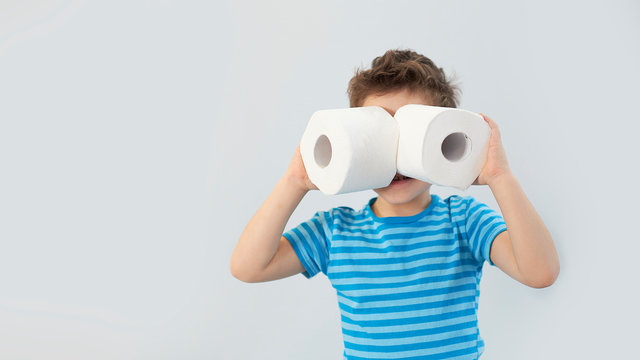 Active Boy Playing With Toilet Paper In Retro Filter,kid Boy Looking Through Toilet Roll,Child Holding Two White Tissue, Looking Through Toilet Paper Like Binoculars