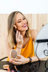 Woman applying powder