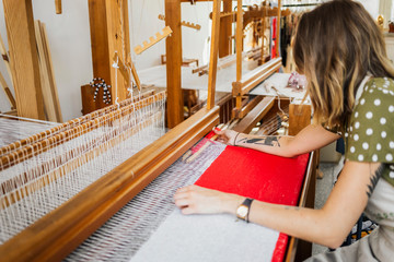Designer weaving her own fabric