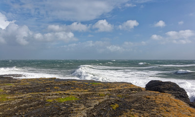 Fototapeta na wymiar A large Atlantic Storm over the coastline of County Wexford, with High Winds and a large Running Swell coming in from the West.