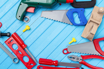 kids, children colorful toys, tools, wrenches, instrument background with copy space