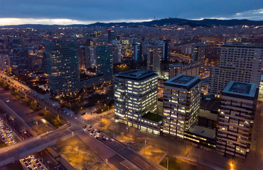 Fototapeta na wymiar European city Barcelona with view of blocks of flats in evening