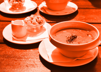 Lush lava color. dishes with food on the table in orange. dishes in a lush lava color cafe.