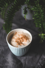 Cappuccino in beautiful cup on the table