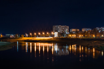 Fototapeta na wymiar Amazing view of the night city of Mogilev across the Dnieper River. Belarus