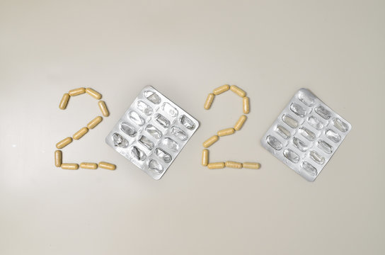 Assortedpharmaceuticals antibiotics pills medicine. colorful antibacterials pills on beige background. capsule pill medicine. Simbol of 2020 year, cronavirus broblem