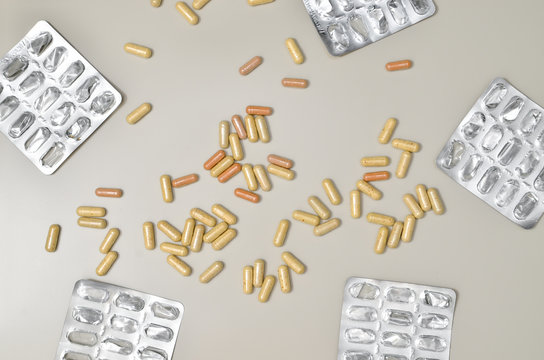 Assortedpharmaceuticals antibiotics pills medicine. colorful antibacterials pills on beige background. capsule pill medicine. Simbol of 2020 year, cronavirus broblem