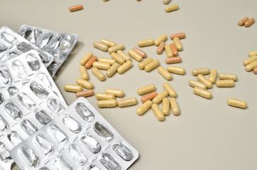 Assortedpharmaceuticals antibiotics pills medicine. colorful antibacterials pills on beige background. capsule pill medicine. Simbol of 2020 year, cronavirus broblem