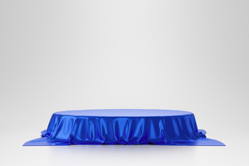 Blue luxurious fabric or cloth placed on top pedestal or blank podium shelf on white background...