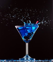 blue cocktail splashing