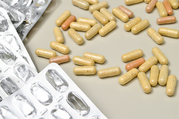 Assortedpharmaceuticals antibiotics pills medicine. colorful antibacterials pills on beige background. capsule pill medicine. Simbol of 2020 year, cronavirus broblem