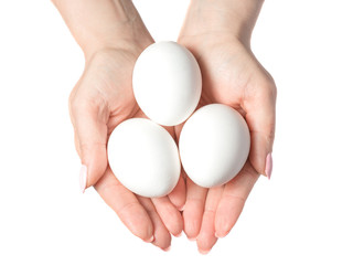 Woman hands with white eggs isolated on white background