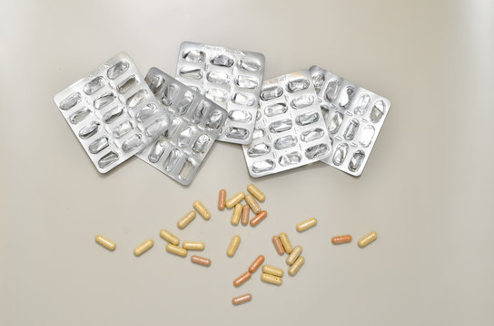 Assortedpharmaceuticals antibiotics pills medicine. colorful antibacterials pills on beige background. capsule pill medicine. Simbol of 2020 year, cronavirus broblem