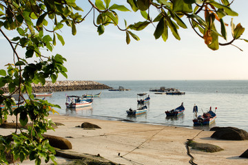Timber fishing boats moored on the beach Penang