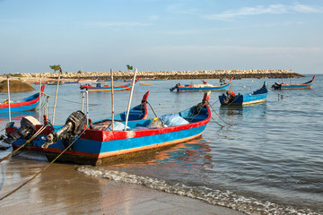 Fototapeta na wymiar Timber fishing boats moored on the beach Penang