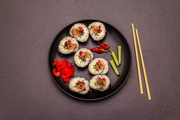 Korean roll Gimbap(kimbob). Steamed white rice (bap) and various other ingredients. Trendy black background