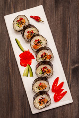 Korean roll Gimbap(kimbob). Steamed white rice (bap) and various other ingredients. Trendy black background