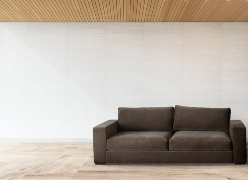 Sofa by a tiled wall