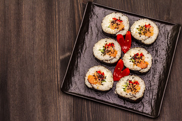 Korean roll Gimbap(kimbob). Steamed white rice (bap) and various other ingredients. Trendy black background
