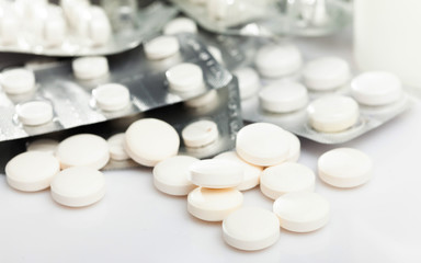 Fototapeta na wymiar Pile of pills and other drugs closeup