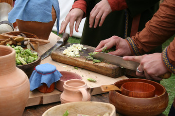 People prepare authentic food at the reenactment of The Battle of Hastings in the UK