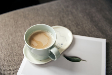 top view of white cup with fresh latte coffee 