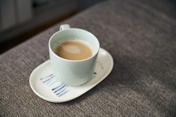 top view of white cup with fresh latte coffee 