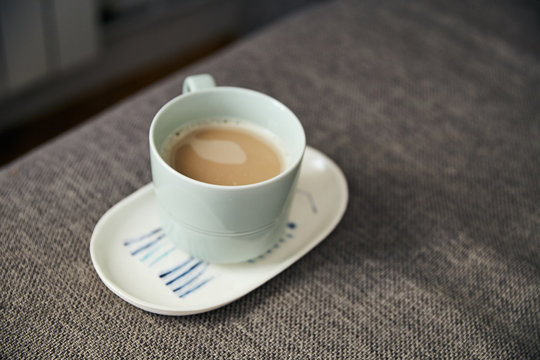 top view of white cup with fresh latte coffee 
